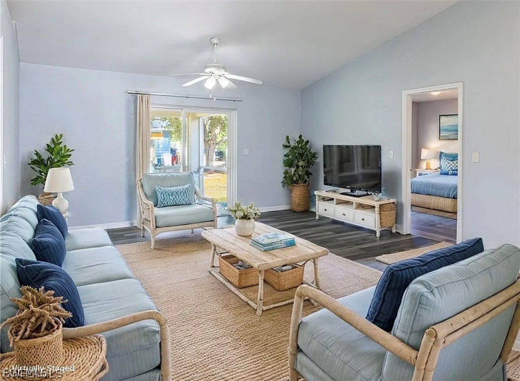4716 1st Street Southwest Lehigh Acres, FL 33973 - Photo 12 of 20 a living room with furniture a flat screen tv and a large window