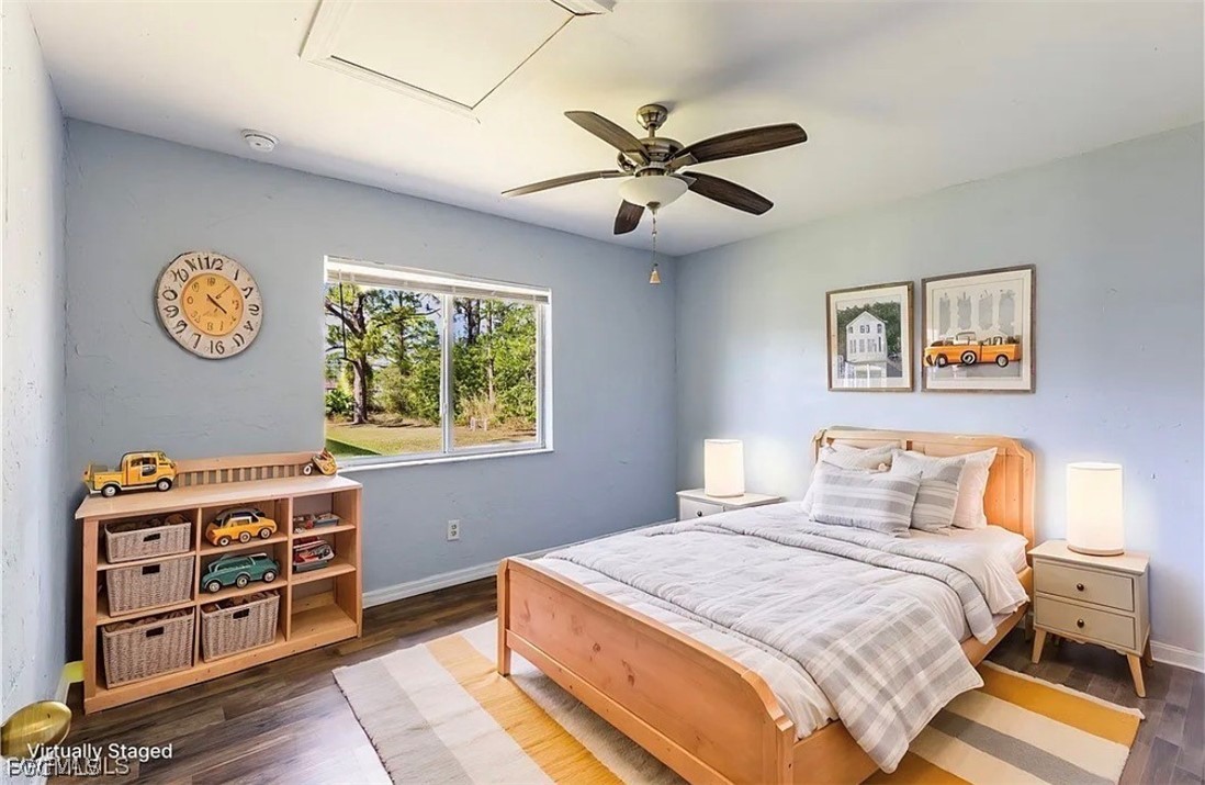 4716 1st Street Southwest Lehigh Acres, FL 33973 - Photo 7 of 20 a bedroom with a bed and a window