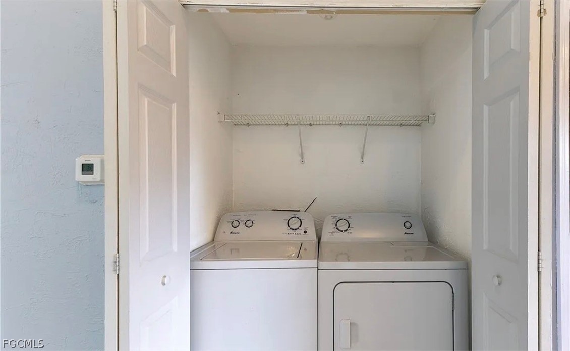 4716 1st Street Southwest Lehigh Acres, FL 33973 - Photo 10 of 20 a utility room with dryer and washer