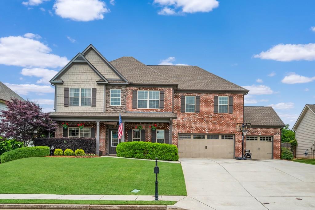 a front view of a house with a yard