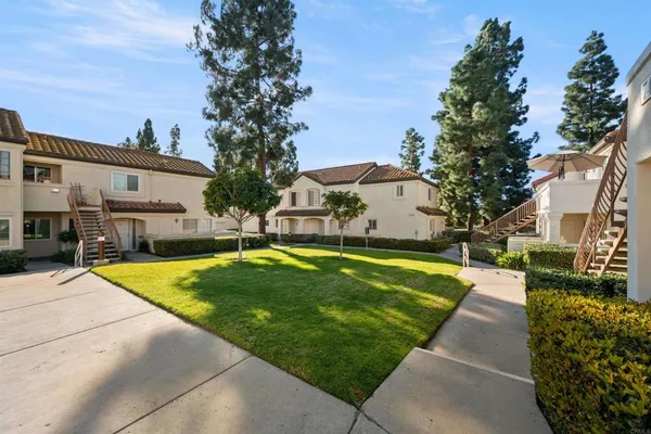 a view of swimming pool with outdoor seating and yard in the back