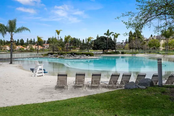a view of a lake with outdoor seating space