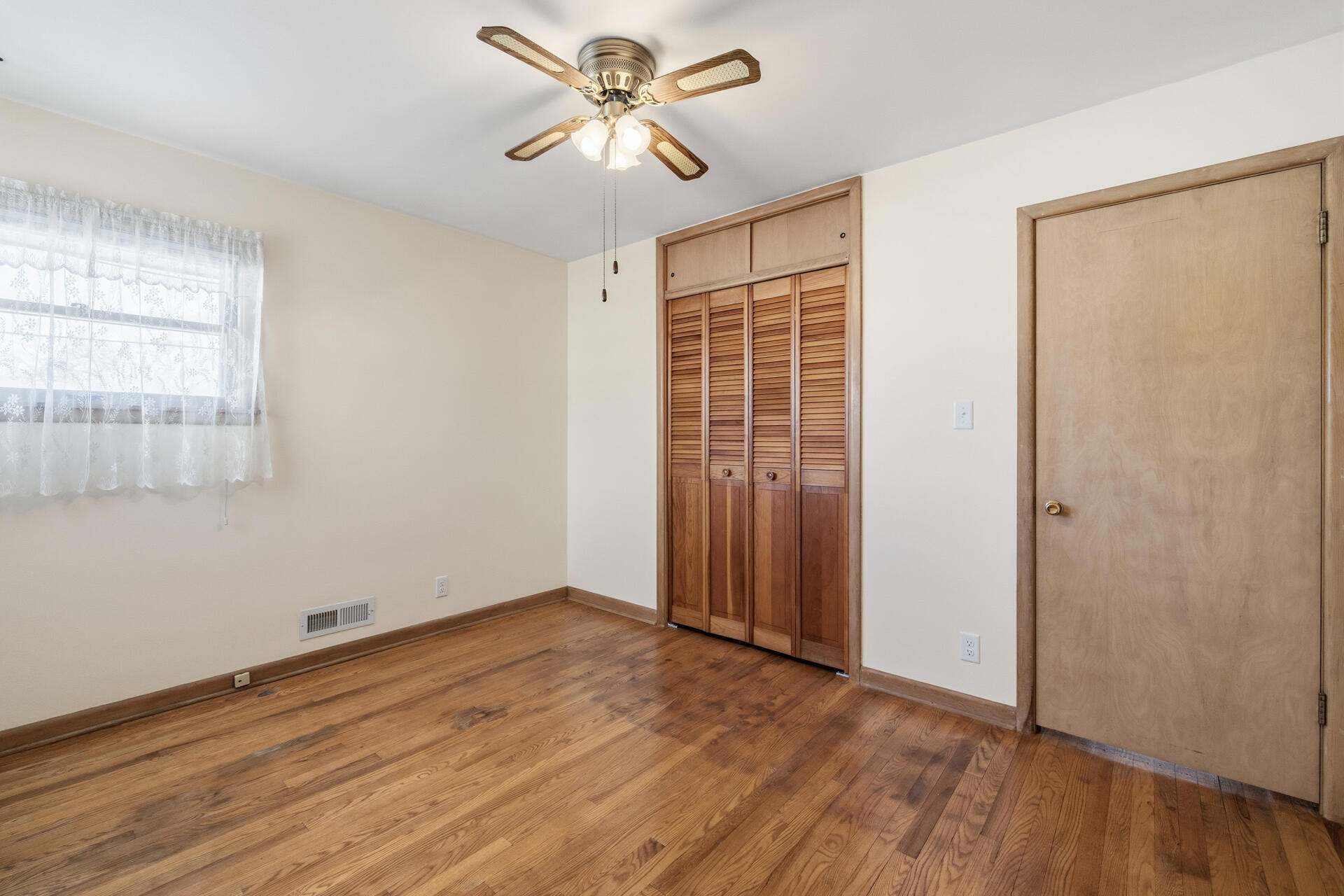4134 North 80th Street Milwaukee, WI 53222 - Photo 15 of 28 Bedroom 2 with oak hard wood floors- closet view