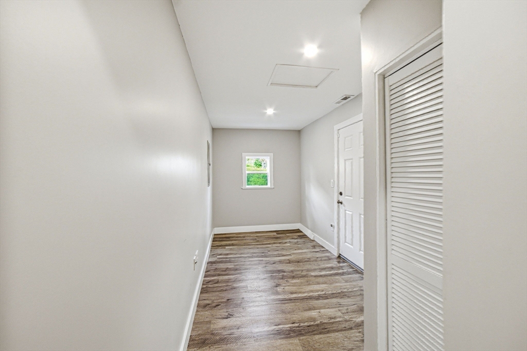 157 Errol Road Brockton, MA 02302 - Photo 30 of 34 a view of a hallway with wooden floor and staircase