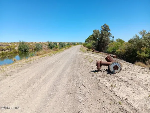 a view of a mountain with a yard