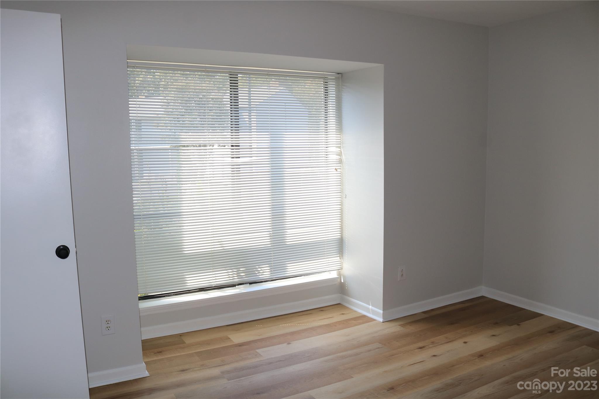 11011 Harrowfield Road Charlotte, NC 28226 - Photo 16 of 24 a view of wooden floor and brick walls
