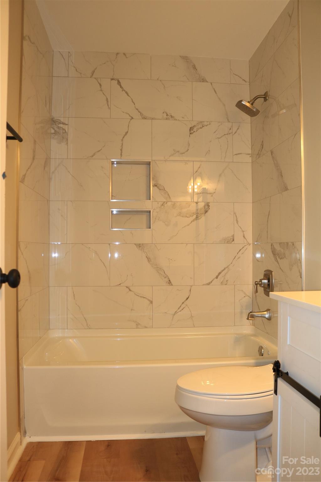 11011 Harrowfield Road Charlotte, NC 28226 - Photo 22 of 24 a bathroom with a toilet and a bathtub