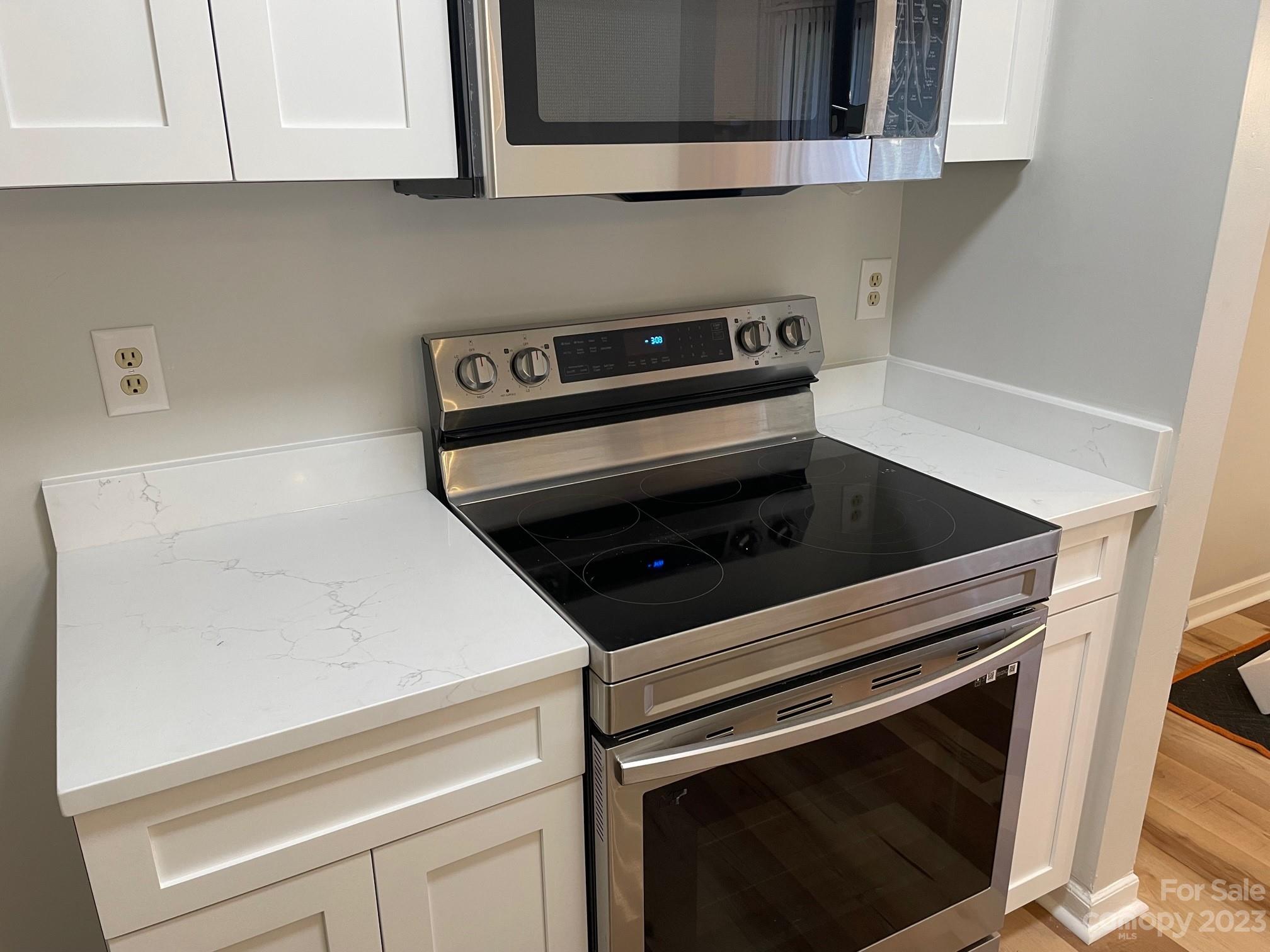 11011 Harrowfield Road Charlotte, NC 28226 - Photo 4 of 24 a stove top oven sitting inside of a kitchen