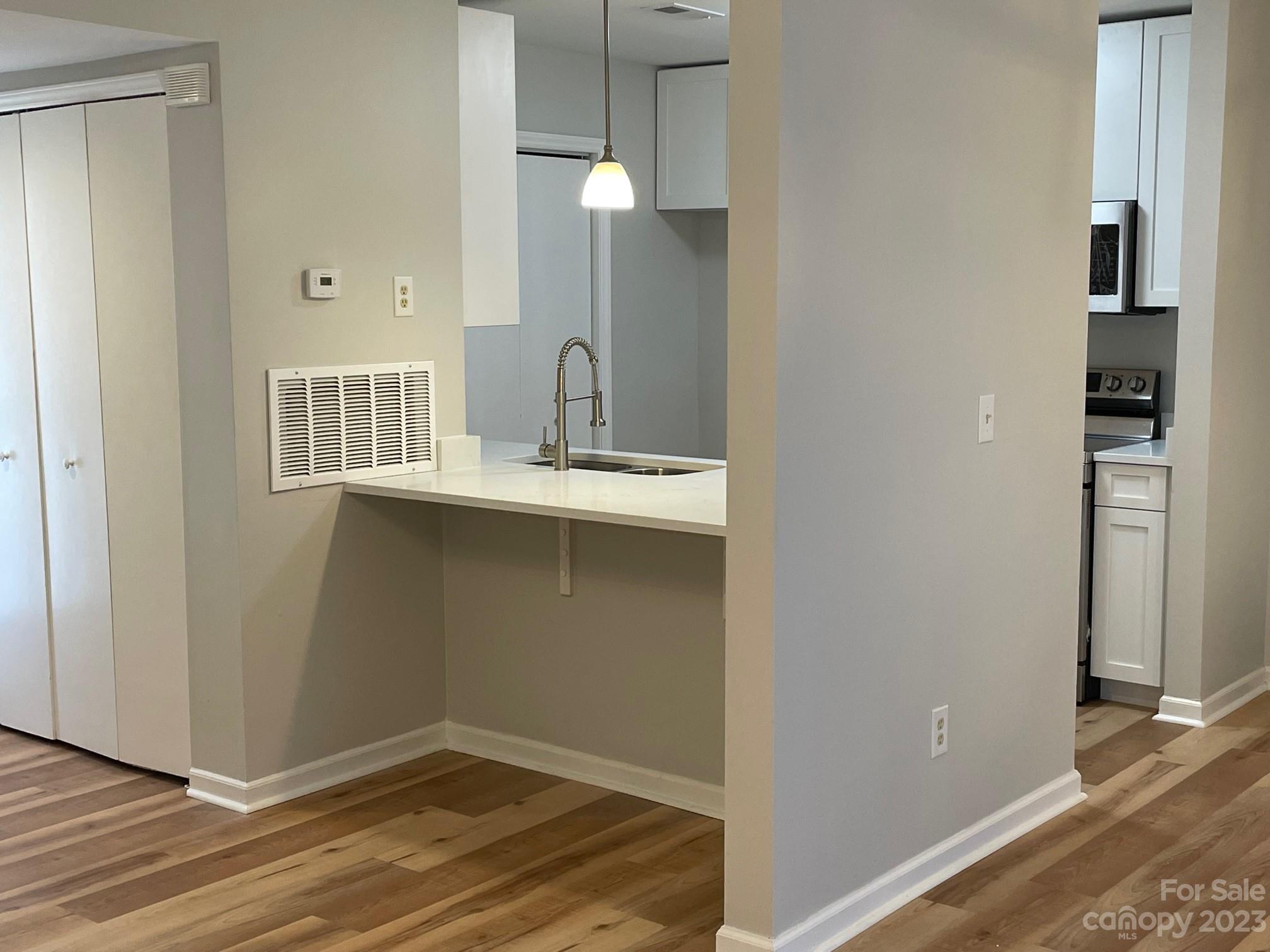 11011 Harrowfield Road Charlotte, NC 28226 - Photo 7 of 24 a view of a kitchen from the hallway