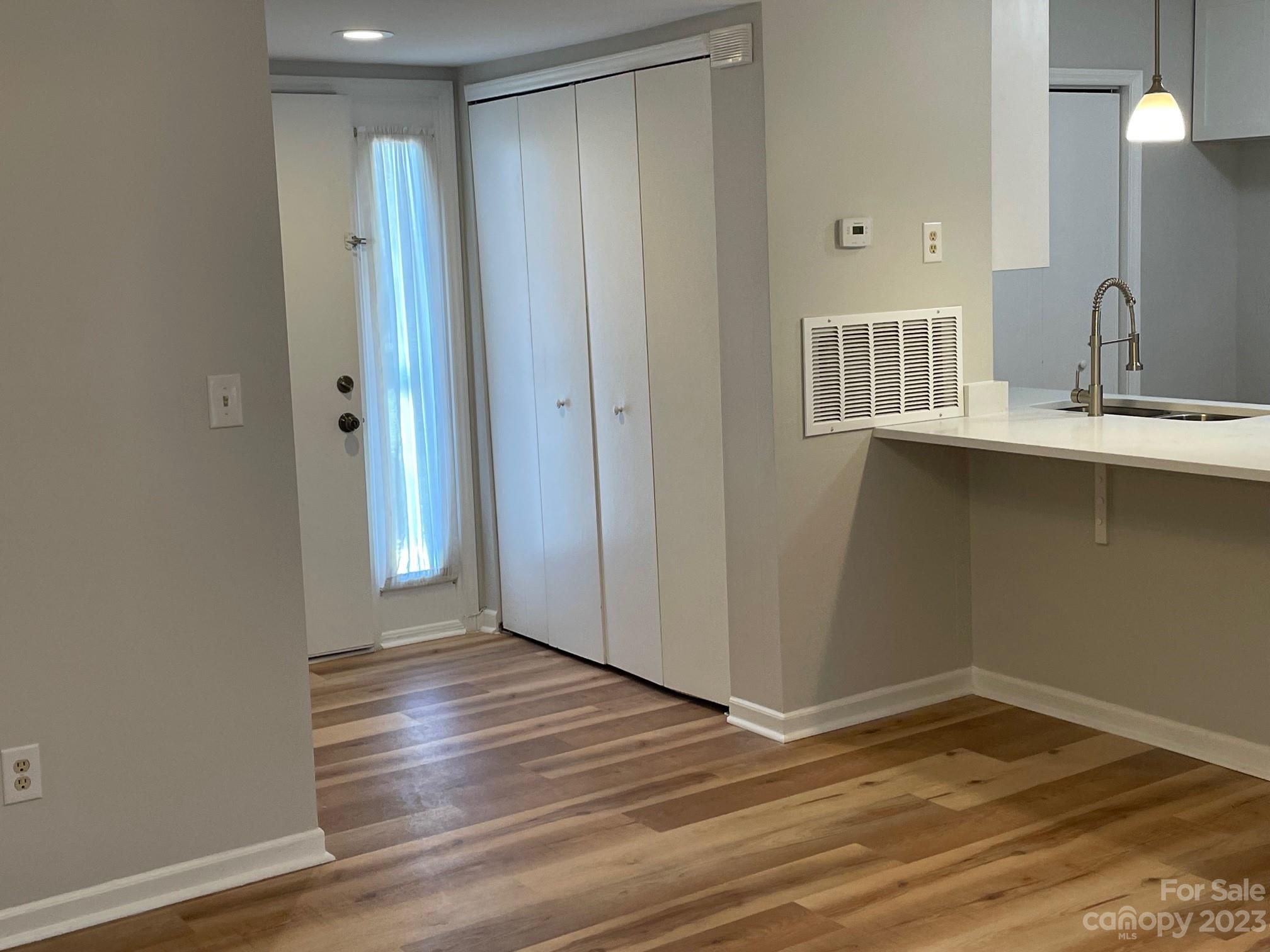 11011 Harrowfield Road Charlotte, NC 28226 - Photo 8 of 24 a view of a room with wooden floor and sink