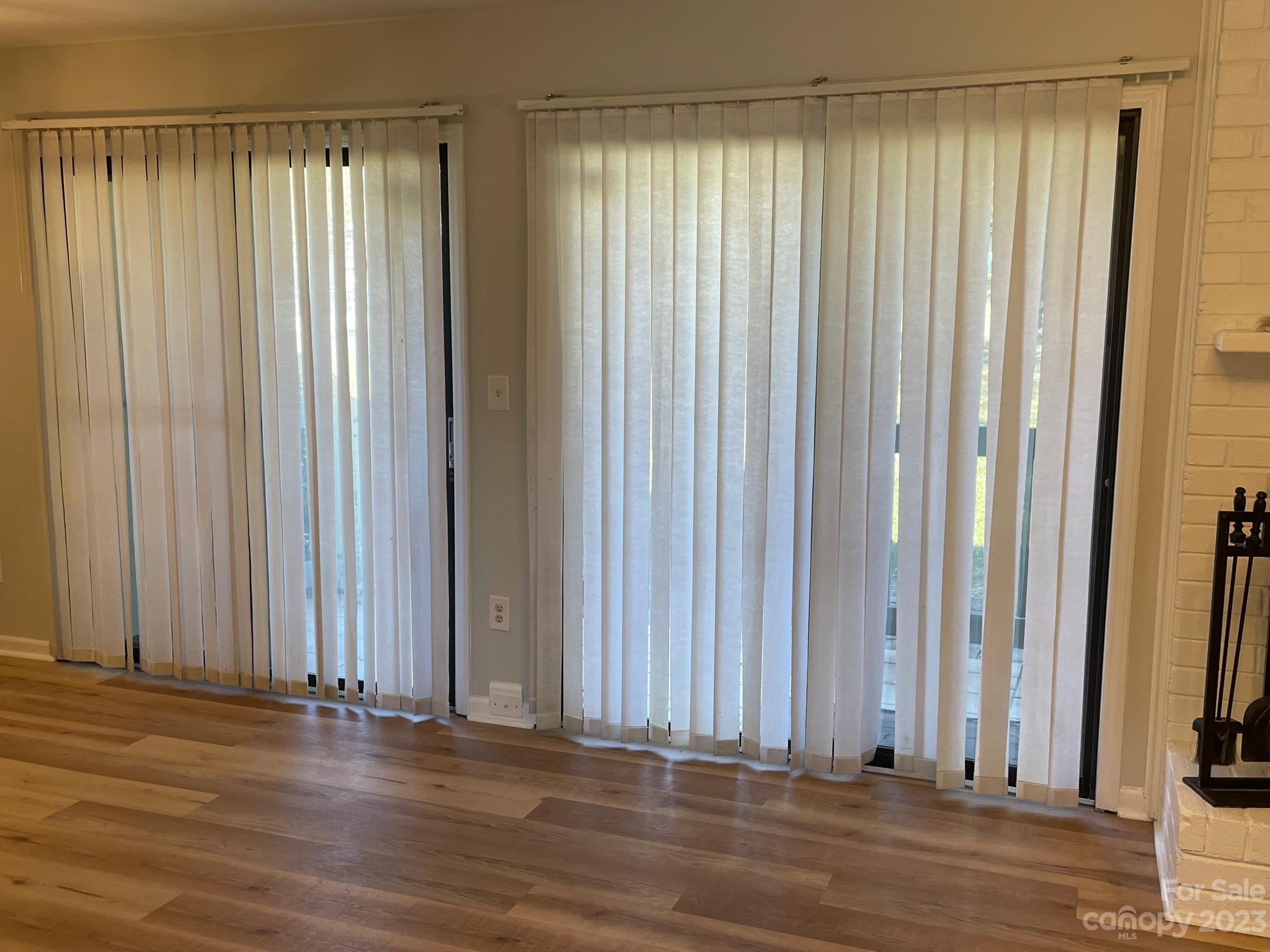 11011 Harrowfield Road Charlotte, NC 28226 - Photo 9 of 24 an empty room with wooden floor and a window