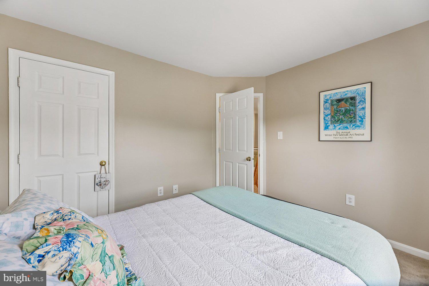 3707 Turn Back Trail Triangle, VA 22172 - Photo 36 of 55 a bedroom with a bed and painting on the wall