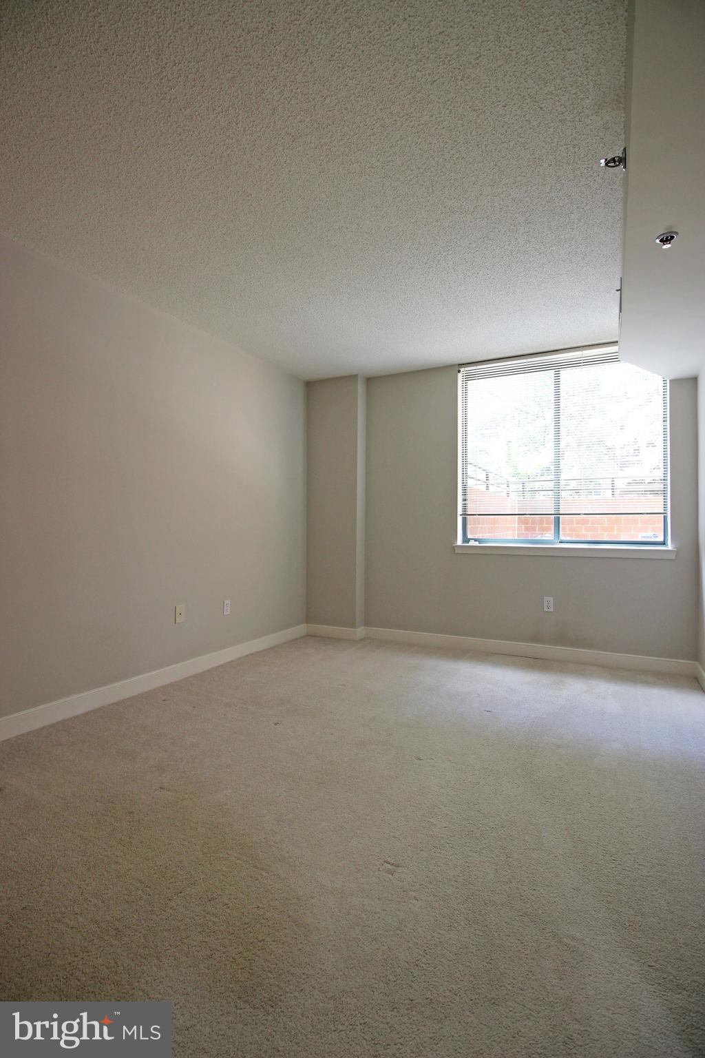 1045 North Utah Street, Unit 108 Arlington, VA 22203 - Photo 16 of 22 an empty room with a window