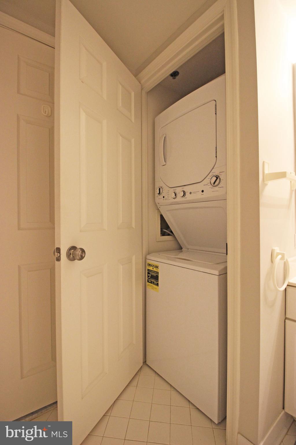 1045 North Utah Street, Unit 108 Arlington, VA 22203 - Photo 20 of 22 a utility room with dryer and washer