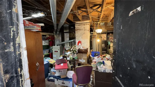 a view of a house with backyard water fountain and sitting area