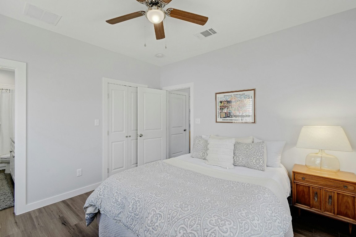 14922 Running Deer Trail Austin, TX 78734 - Photo 24 of 31 a bedroom with a bed and a lamp