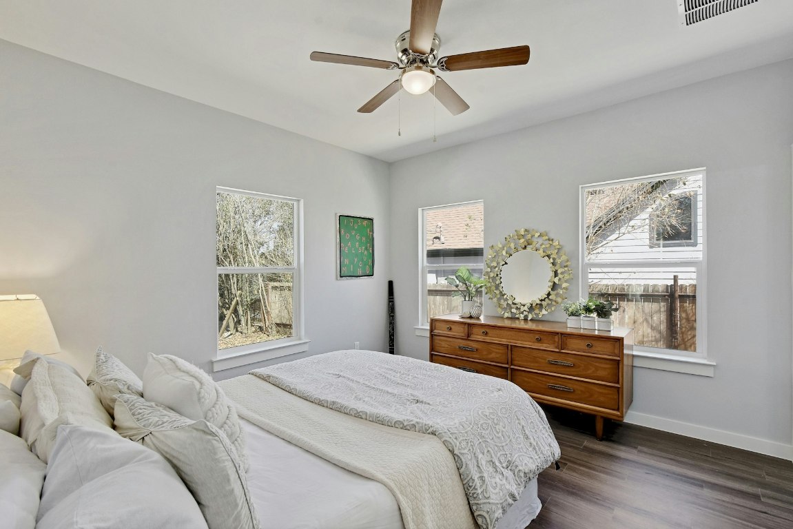 14922 Running Deer Trail Austin, TX 78734 - Photo 25 of 31 a bedroom with a bed and wooden floor