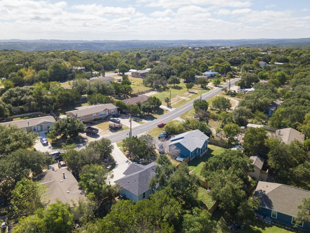14922 Running Deer Trail Austin, TX 78734 - Photo 2 of 31 an aerial view of residential houses with outdoor space and trees