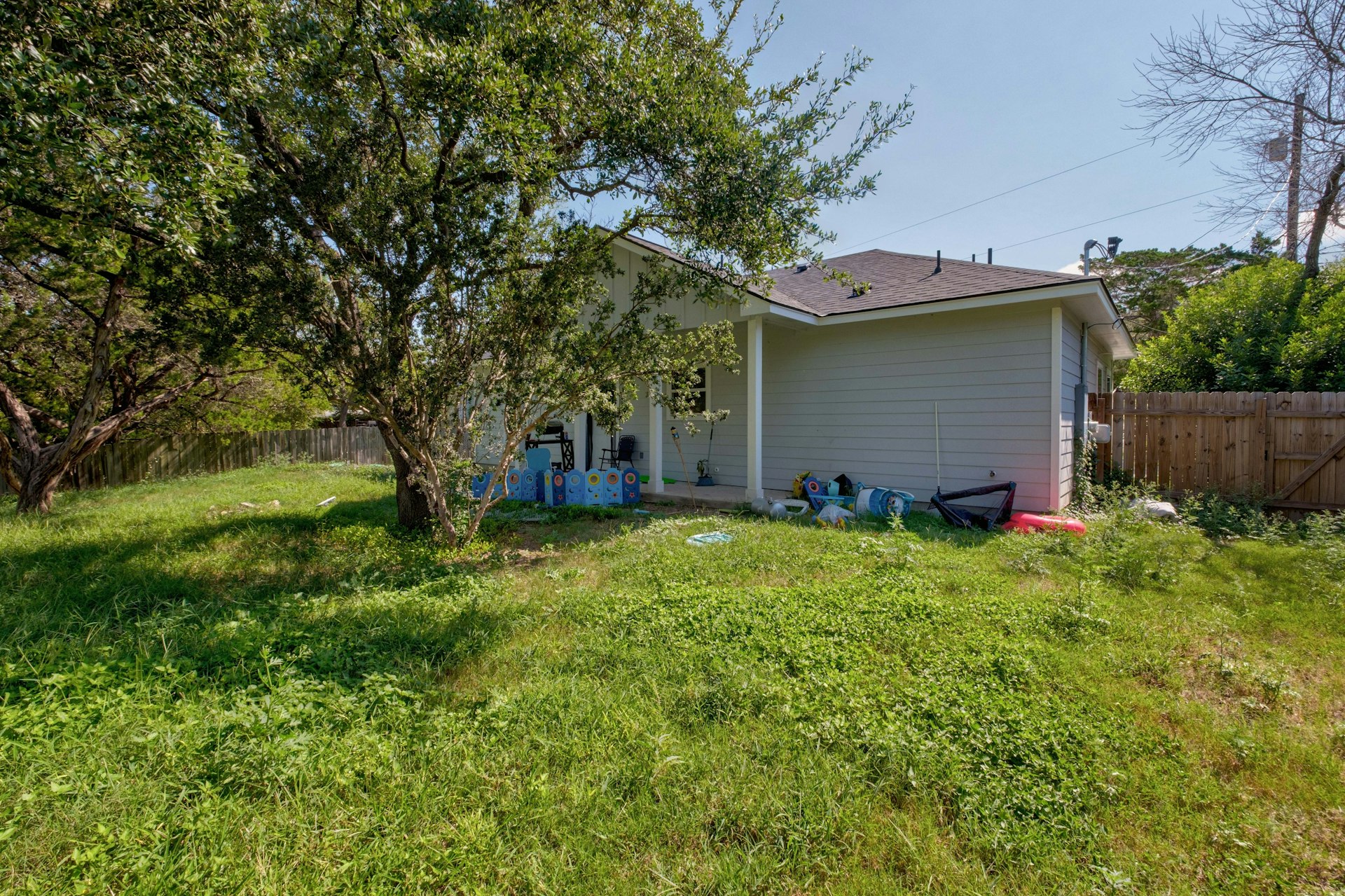 14922 Running Deer Trail Austin, TX 78734 - Photo 5 of 31 Back of house with a yard and fence