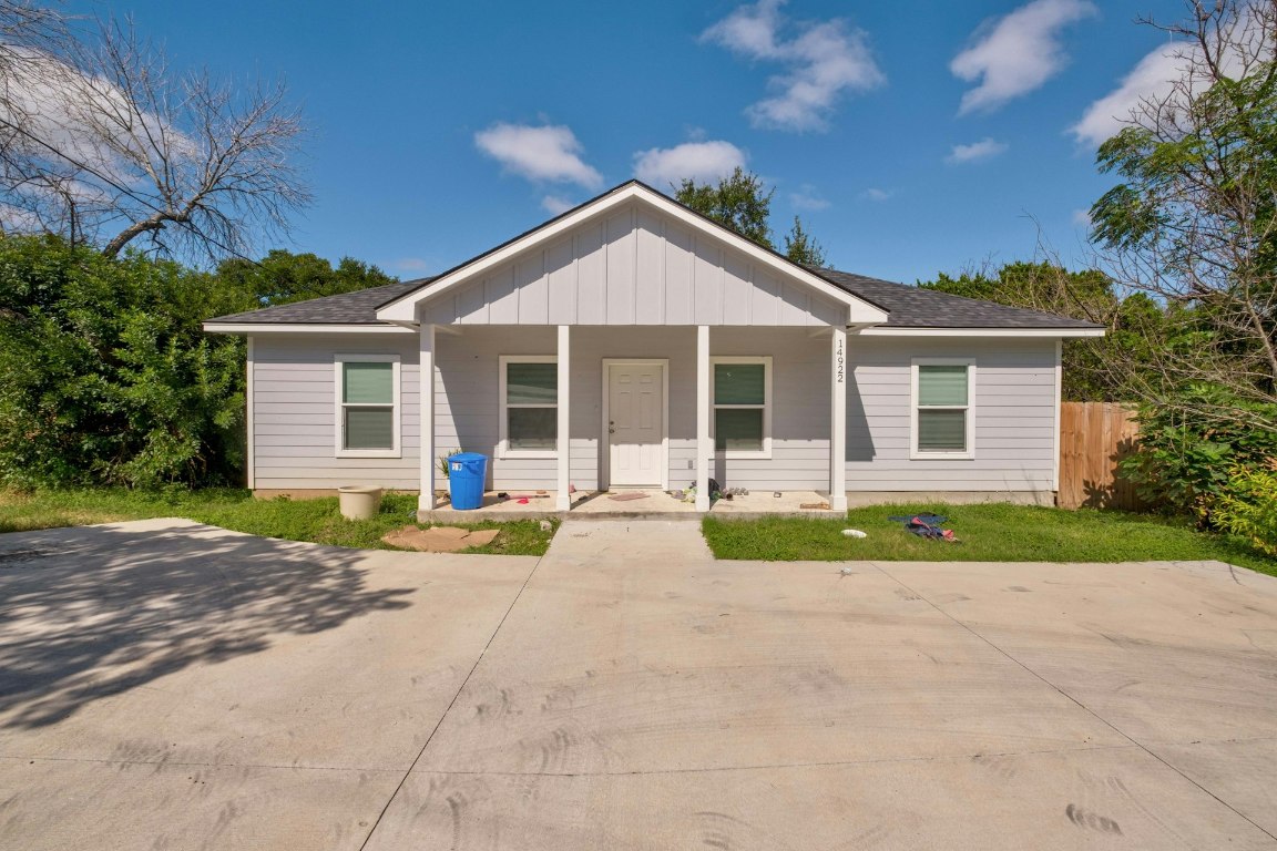 14922 Running Deer Trail Austin, TX 78734 - Photo 3 of 31 a view of a house with a yard and large tree