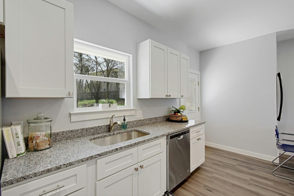 14922 Running Deer Trail Austin, TX 78734 - Photo 17 of 31 a kitchen with a sink and cabinets