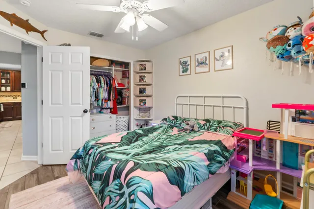 a kitchen with stainless steel appliances granite countertop a stove top oven a sink dishwasher a refrigerator and a microwave