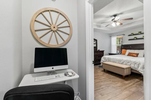 a bedroom with a bed and a chandelier