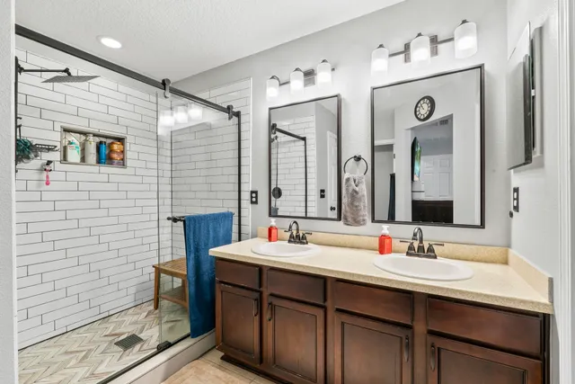 a bathroom with a sink and a mirror