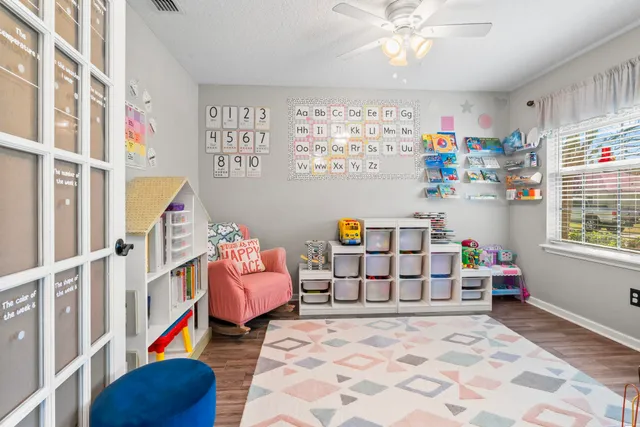 a bedroom with furniture and a window