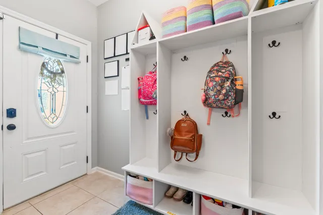 a view of an entryway with wooden floor