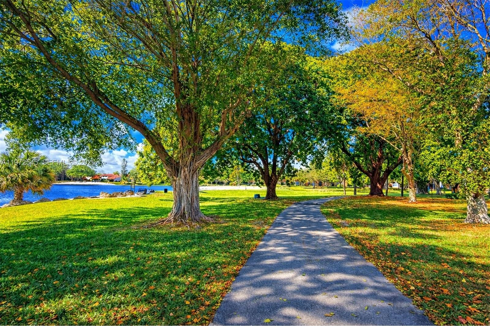 15285 Southwest 107th Lane, Unit 201 Miami, FL 33196 - Photo 11 of 28 a park with large trees
