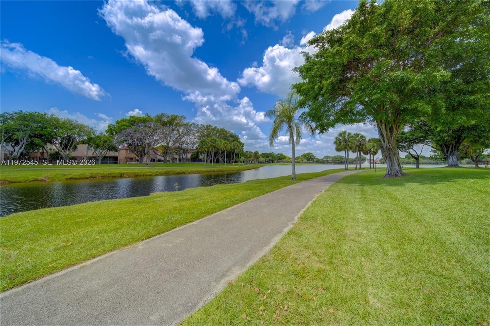 15285 Southwest 107th Lane, Unit 201 Miami, FL 33196 - Photo 22 of 28 a view of a park with large trees