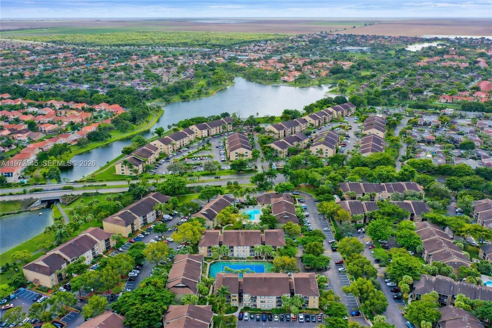 15285 Southwest 107th Lane, Unit 201 Miami, FL 33196 - Photo 25 of 28 a view of a city with a lake
