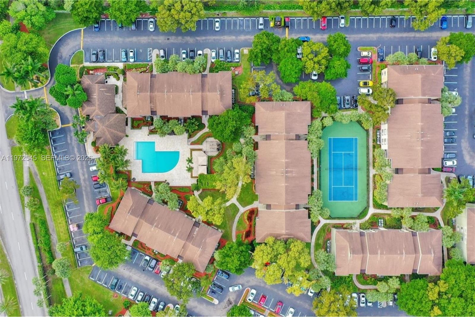 15285 Southwest 107th Lane, Unit 201 Miami, FL 33196 - Photo 26 of 28 an aerial view of a house with a garden and plants