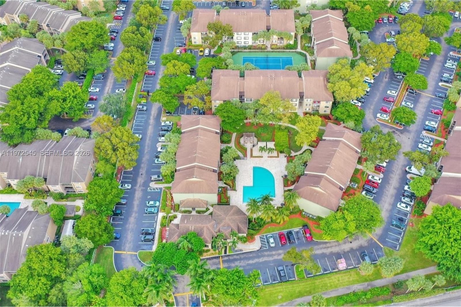 15285 Southwest 107th Lane, Unit 201 Miami, FL 33196 - Photo 27 of 28 an aerial view of residential house with outdoor space and swimming pool