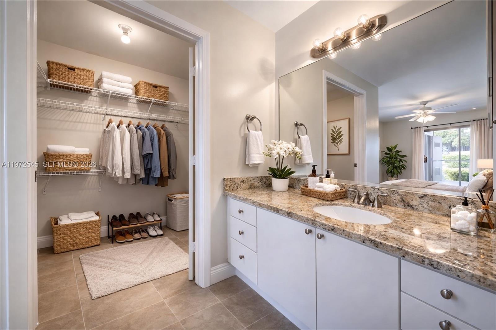 15285 Southwest 107th Lane, Unit 201 Miami, FL 33196 - Photo 5 of 28 a bathroom with a double vanity sink and a mirror