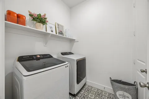 a utility room with dryer and washer