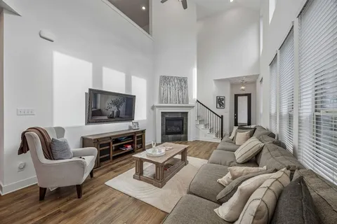 a living room with furniture or couch and a flat screen tv