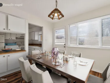 a view of a dining room with furniture window and outside view