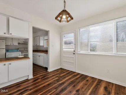 a view of a kitchen from the hallway