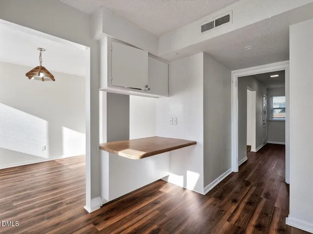 a view of a hallway view with wooden floor and staircase