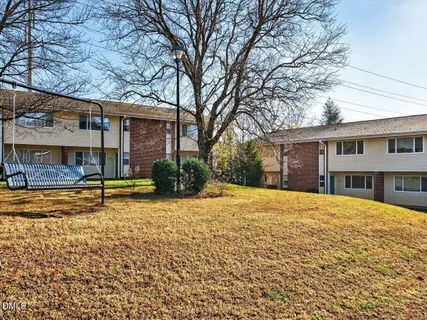 a view of a house with snow on the tree