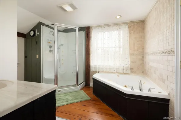 a bathroom with a bathtub and a sink