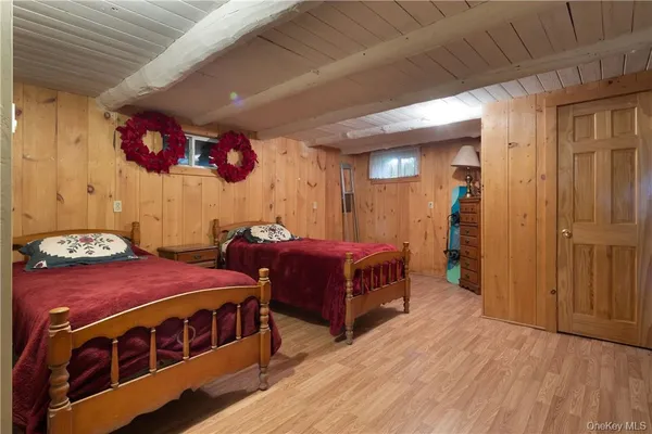 a bedroom with bed and a walk in closet