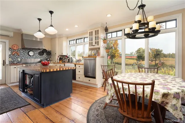 a kitchen with stainless steel appliances granite countertop a stove and refrigerator