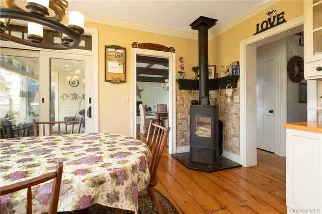 a bedroom with a bed and a dresser with mirror