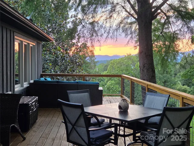 a view of balcony with furniture and trees