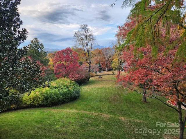 an aerial view of a house with mountain view