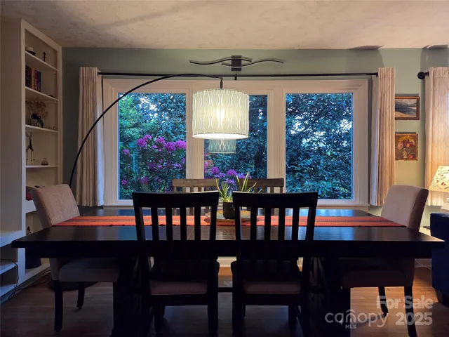 a view of a dining room with furniture and window