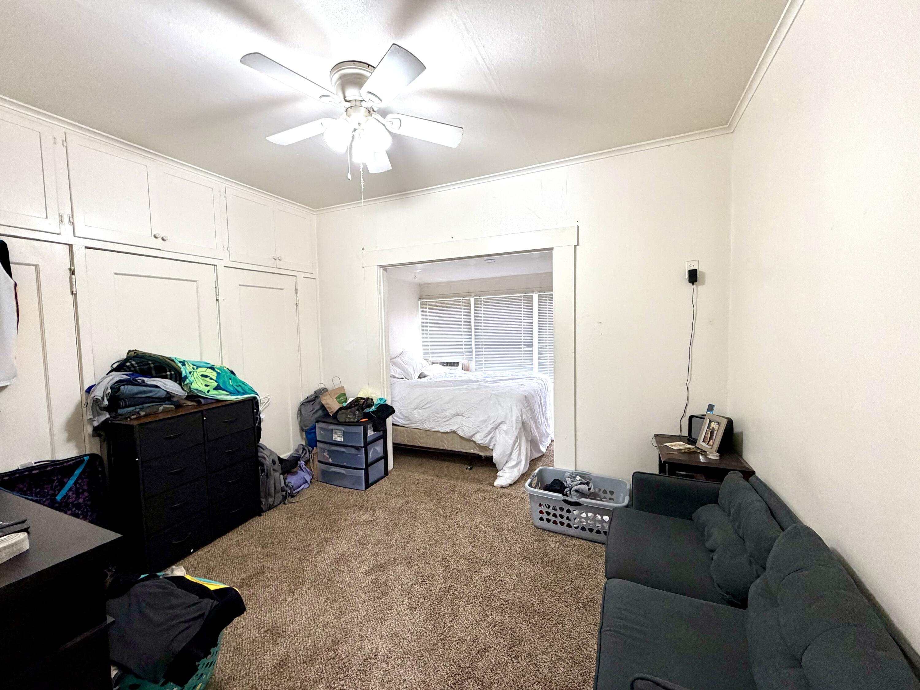 200 North B Street Exeter, CA 93221 - Photo 5 of 20 a bedroom with bed and window